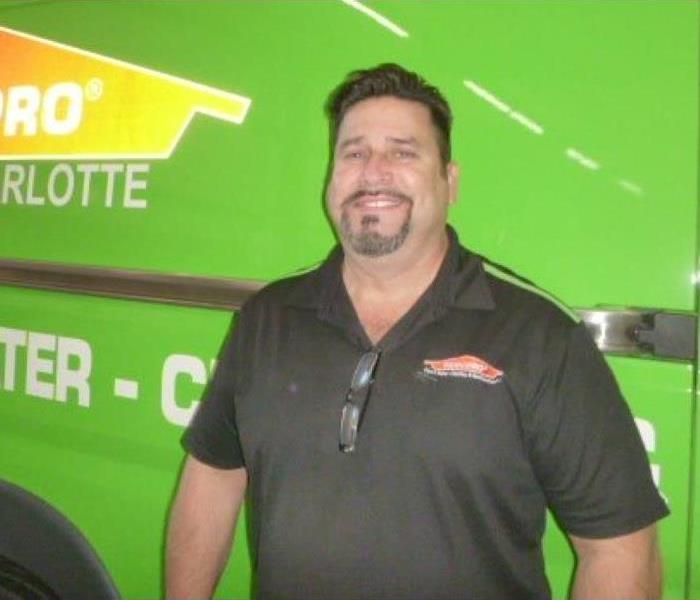 Male with brown hair in a SERVPRO uniform